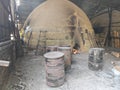 charcoal kiln containers where carbonization or burning of wood to produce pure carbon at factory Royalty Free Stock Photo