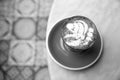 Charcoal latte on marble table background