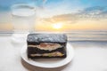 Charcoal sandwiches with sunrise on the beach.