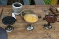 charcoal, sulfur, saltpeter in bowls for making black powder. ÃÂ¡asting of lead bullets