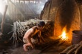 A charcoal worker at work on a pile of slow burning wood charcoal factory Royalty Free Stock Photo