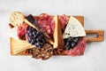 Charcuterie board top view on a white marble background Royalty Free Stock Photo