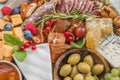 Charcuterie board. Cheese platter. Assortment of tasty appetizers or antipasti. Top view. Copy space Royalty Free Stock Photo