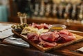 Charcuterie board with cured pork meat, sauce, bread and olive Royalty Free Stock Photo