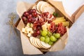 Charcuterie board in a box with cheese and meat