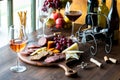 A charcuterie board of gourmet meats and cheese with red, white and rose wine. Royalty Free Stock Photo