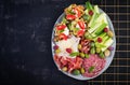 Charcuterie board. Platter: parmesan with prosciutto, salami, cucumbers and olives. Royalty Free Stock Photo