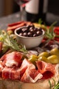 Charcuterie board with spanish jamon, pork sausage with pepper, fuet, cheese and berries. Traditional tapas Royalty Free Stock Photo