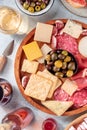 Charcuterie and cheese board close-up with wine and olives, shot from above Royalty Free Stock Photo