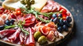 Charcuterie plate with prosciutto salami cheese and berries olives Aperitif Antipasti Italian table Royalty Free Stock Photo