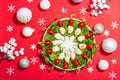 Charcuterie wreath in traditional New Year color design with Christmas decorations. Modern snack Royalty Free Stock Photo