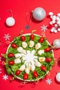 Charcuterie wreath in traditional New Year color design with Christmas decorations. Modern snack Royalty Free Stock Photo