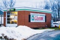 Chardon, Ohio, USA - 2-21-22: A sign for Castrol brand oil on the side of a small automotive repair shop