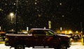 Chardon, Ohio, USA - 2-12-22: A snow-covered Walmart parking lot at night, during a severe snowstorm