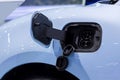 Charge port on an electric car, Ev Charging Port on electric car. Electronic car charging devise publicly installed. EV charger o