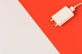 Charger on white red background. Close up. Empty text space Royalty Free Stock Photo