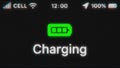 Charging Battery appear on old display. Pixeled text animation with phone hud. Green battery icon.