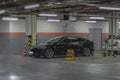 Charging an electric car in the parking lot in the underground parking