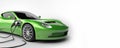 Charging electric sports car in green color. E-Mobility and ecology. Battery charging concept