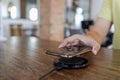 Charging mobile phone battery with wireless charging device in the table. Smartphone charging on a charging pad. Mobile phone near Royalty Free Stock Photo