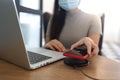 Charging mobile phone battery with wireless charging device in the table. Smartphone charging on a charging pad. Mobile phone near Royalty Free Stock Photo