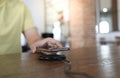 Charging mobile phone battery with wireless charging device in the table. Smartphone charging on a charging pad. Mobile phone near Royalty Free Stock Photo