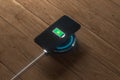 The charging mobile phone with wireless charger, 3d rendering