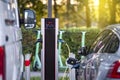 Charging modern electric vehicles at a street station. The process of charging an electric car. Royalty Free Stock Photo