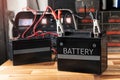 Charging motorcycle battery at garage,concept of motorcycle maintenance and repair
