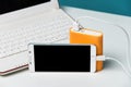 Charging smart phone with portable external battery on Modern la Royalty Free Stock Photo