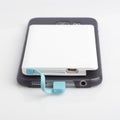 Charging a smartphone from powerbank on white Royalty Free Stock Photo