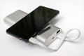 Charging smartphone from white powerbank Royalty Free Stock Photo