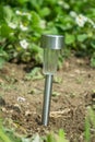 Charging solar lamp on the ground in the garden Royalty Free Stock Photo