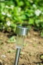 Charging solar lamp on the ground in the garden Royalty Free Stock Photo