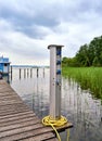 Charging station for boats, sockets for loading ships in the port. Bollard point of electrical outlets on pier at the Schwerin