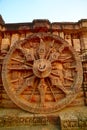 Chariot wheel carved in red sandstone, Sun temple, Konark, India.