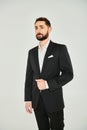 charismatic bearded businessman in black elegant
