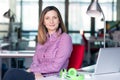 Charismatic Business Lady in casual clothing sitting at Office Table Royalty Free Stock Photo