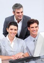 Charismatic business team working at a computer Royalty Free Stock Photo