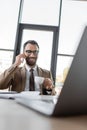 charismatic businessman with beard and brunette