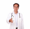 Charismatic doctor standing with greeting gesture