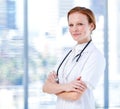 Charismatic female doctor folding her arms Royalty Free Stock Photo