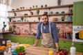 Charismatic and handsome guy looking posing in front of the camera at the kitchen he smiling very cute and wear the Royalty Free Stock Photo