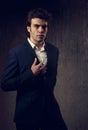 Charismatic handsome male model posing in fashion suit and white Royalty Free Stock Photo