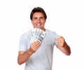 Charismatic latin male holding cash money