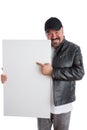 Charismatic man pointing to a blank white sign