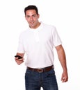 Charismatic man sending a message by cellphone Royalty Free Stock Photo