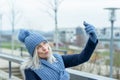 Charismatic stylish woman taking a selfie