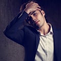 Charismatic tired handsome business man in blue fashion suit and Royalty Free Stock Photo