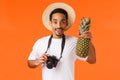 Charismatic young attractive african-american tourist, traveller taking pictures from vacation on camera, holding Royalty Free Stock Photo